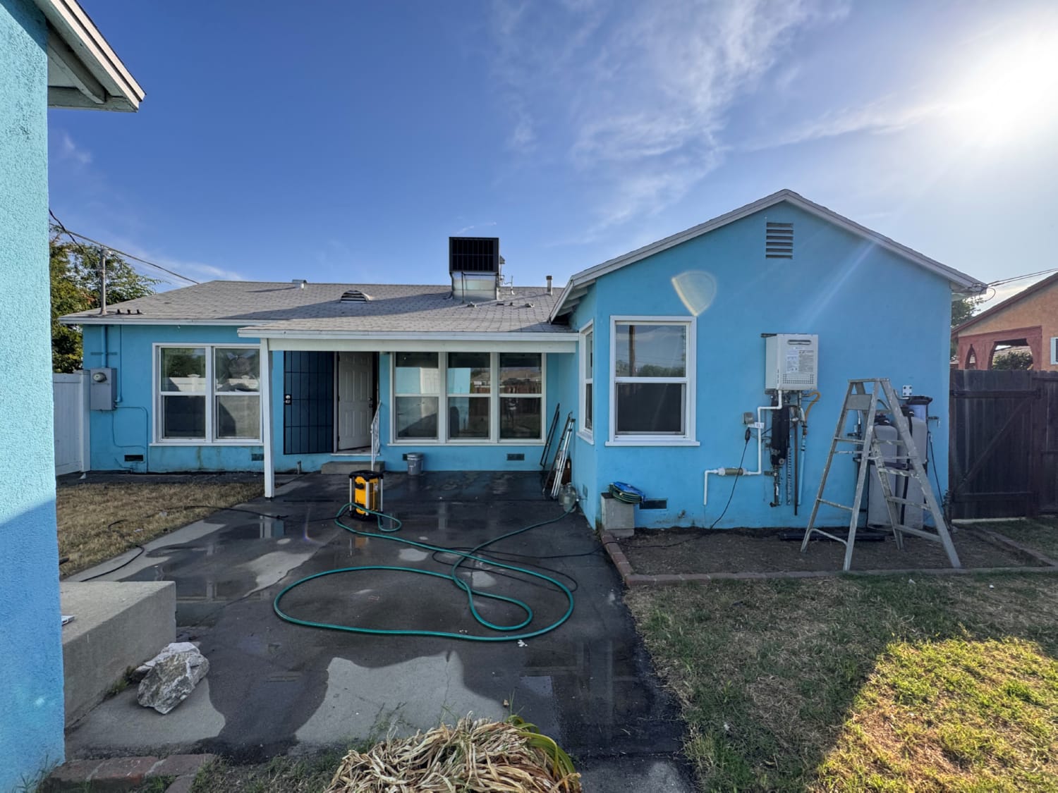 Exterior painting services trim and detail work on house facade