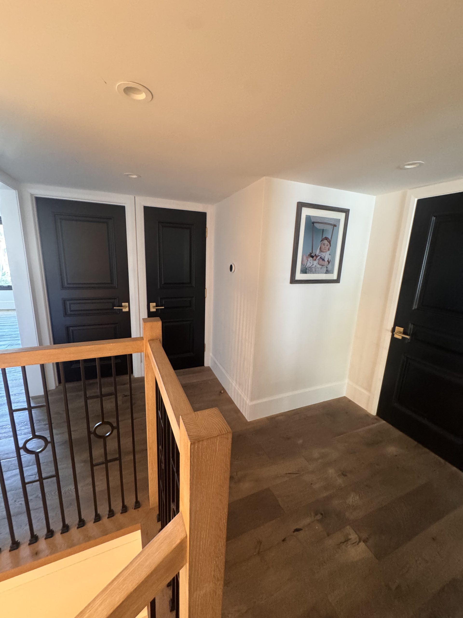 Upstairs hallway black doors
